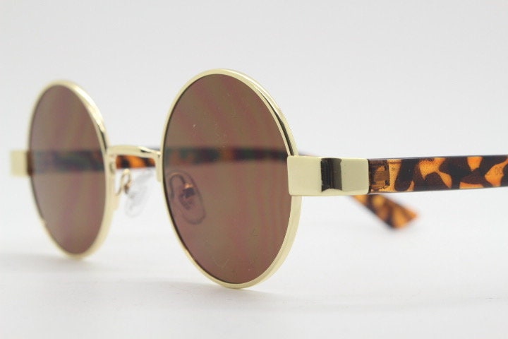 90s round vintage sunglasses. Gold 1920's style frame with tortoise arms and brown lenses. Unused. NOS. Steampunk