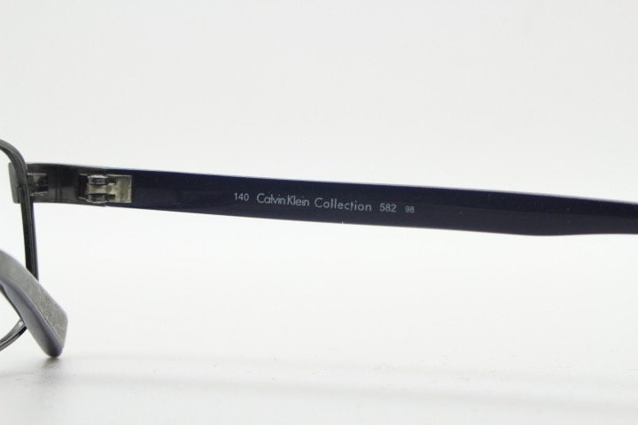 Calvin Klein collection rectangular eye glasses model 582 made in Japan. Gunmetal grey wire optical frames. Prescription eyeglasses. RX