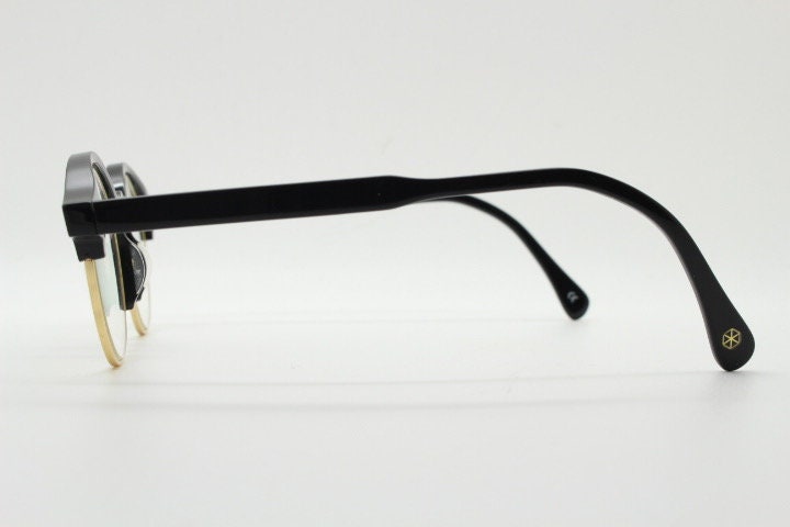 Kaleos round half frame eye glasses. Black gloss acetate browline optical frames with gold underwire. Prescription eyeglasses. RX