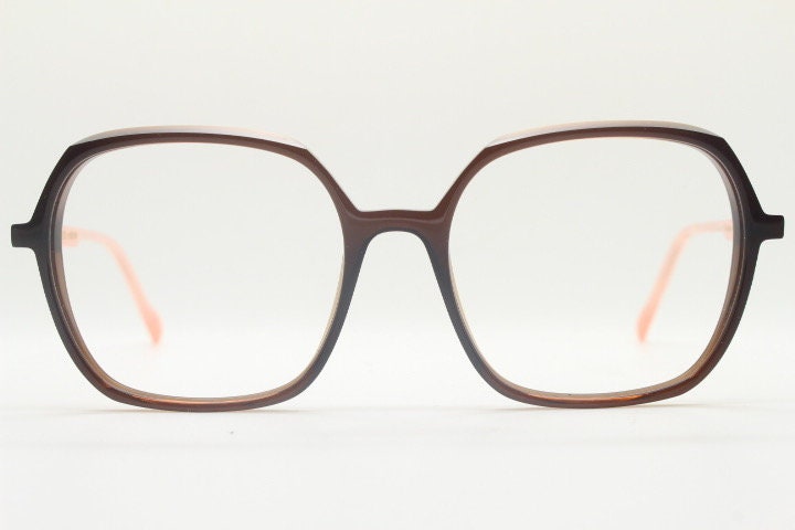 Caroline Abram square hexagon eye glasses model Caline. Dark brown acetate optical frame with pink arms. Prescription RX spectacles