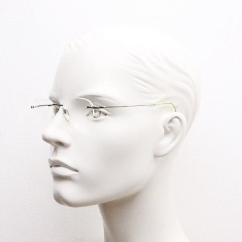 Silhouette rectangular frameless eye glasses made in Austria. Minimal lightweight optical frame with silver trim. Prescription RX