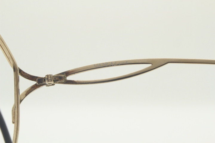 Viennaline 70s vintage angular round eye glasses. Slightly oversized subtle gold chrome optical frame with incredible arms. Prescription RX