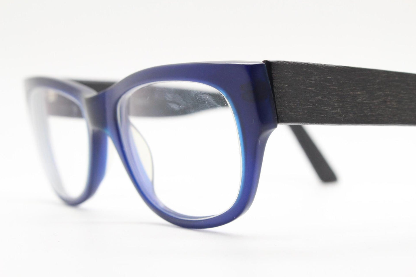 Chunky frame modified cat eye glasses. Superior quality optical eyeglasses. Deep blue front with wood look arms. Prescription RX Spectacles