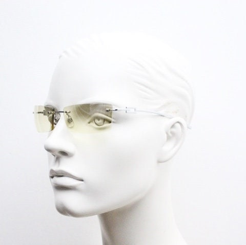 Y2K vintage rectangular sunglasses. Minimal frameless light tone curved mirrored lenses with silver chrome trim. 2000's. 90s. 00s. NOS