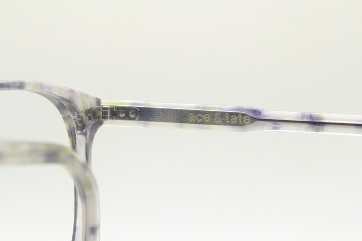 Ace and Tate modified wayfarer design eye glasses hand made in Italy. Crystal acetate optical frame with cloudy gery tones. Prescription RX