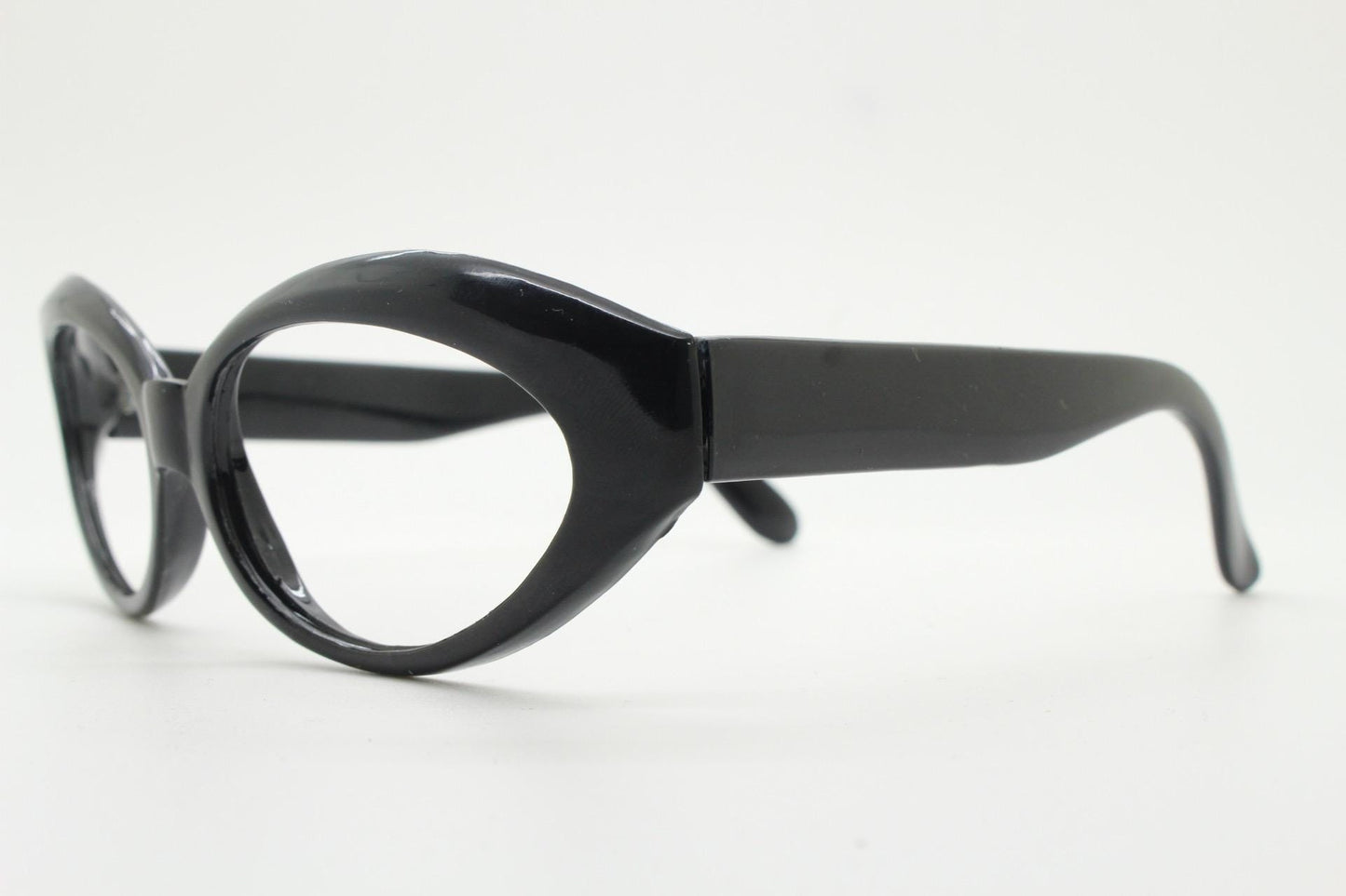 80s vintage oval cat eye glasses. Crop sided dynamic black cateye optical frames. 60s design prescription eyeglasses. RX spectacles. NOS