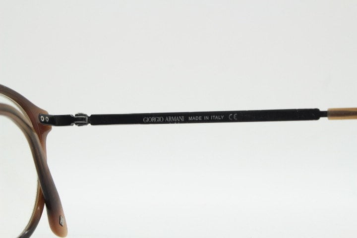 Giorgio Armani eye glasses model 7124 made in Italy. Mottled brown acetate optical frames with flat metal arms. Prescription eyeglasses. RX