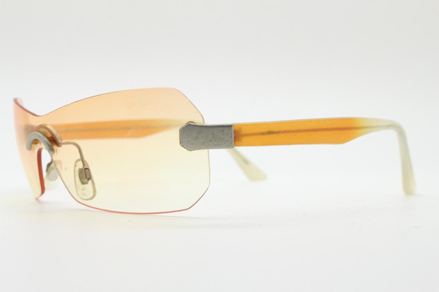 Y2K vintage frameless shield sunglasses. Dynamic 2000's light tone orange mono lens visor with matt silver trim. 00's Cosplay mini mask. NOS