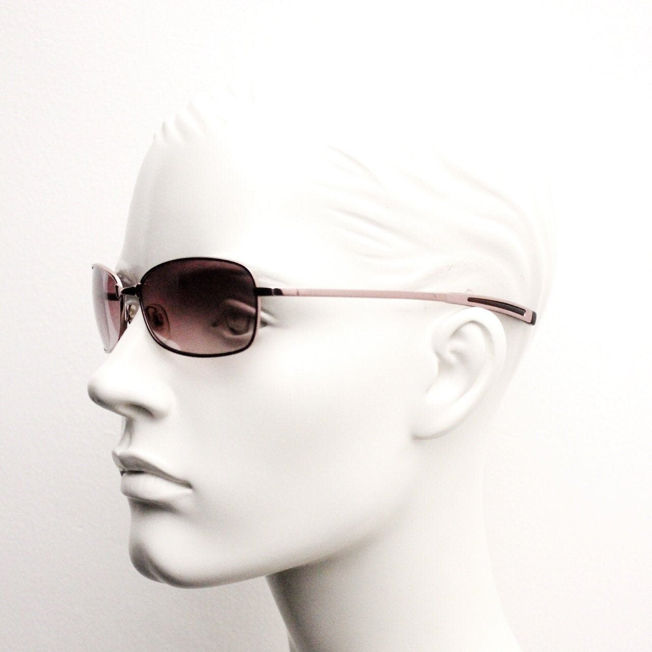 Y2K vintage curved sunglasses. Unusual Pink chrome metal frame with matching flared rectangular lenses. Unused 2000s NOS