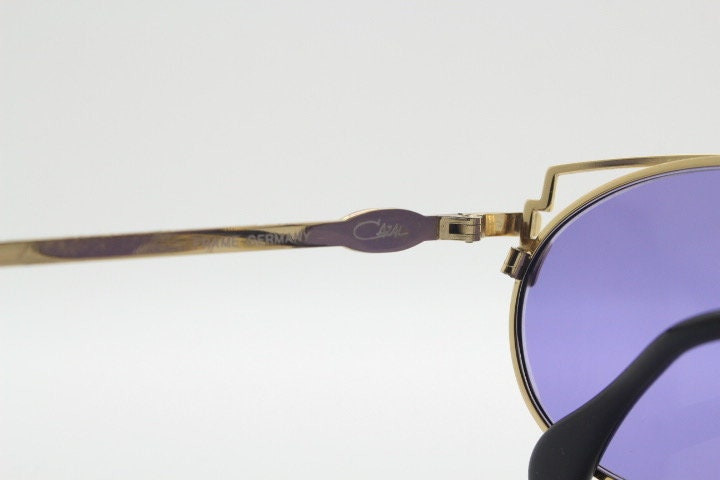 Cazal 90s vintage sunglasses made in Germany. Dynamic multi colour enamelled frame with custom ordered unique purple lenses