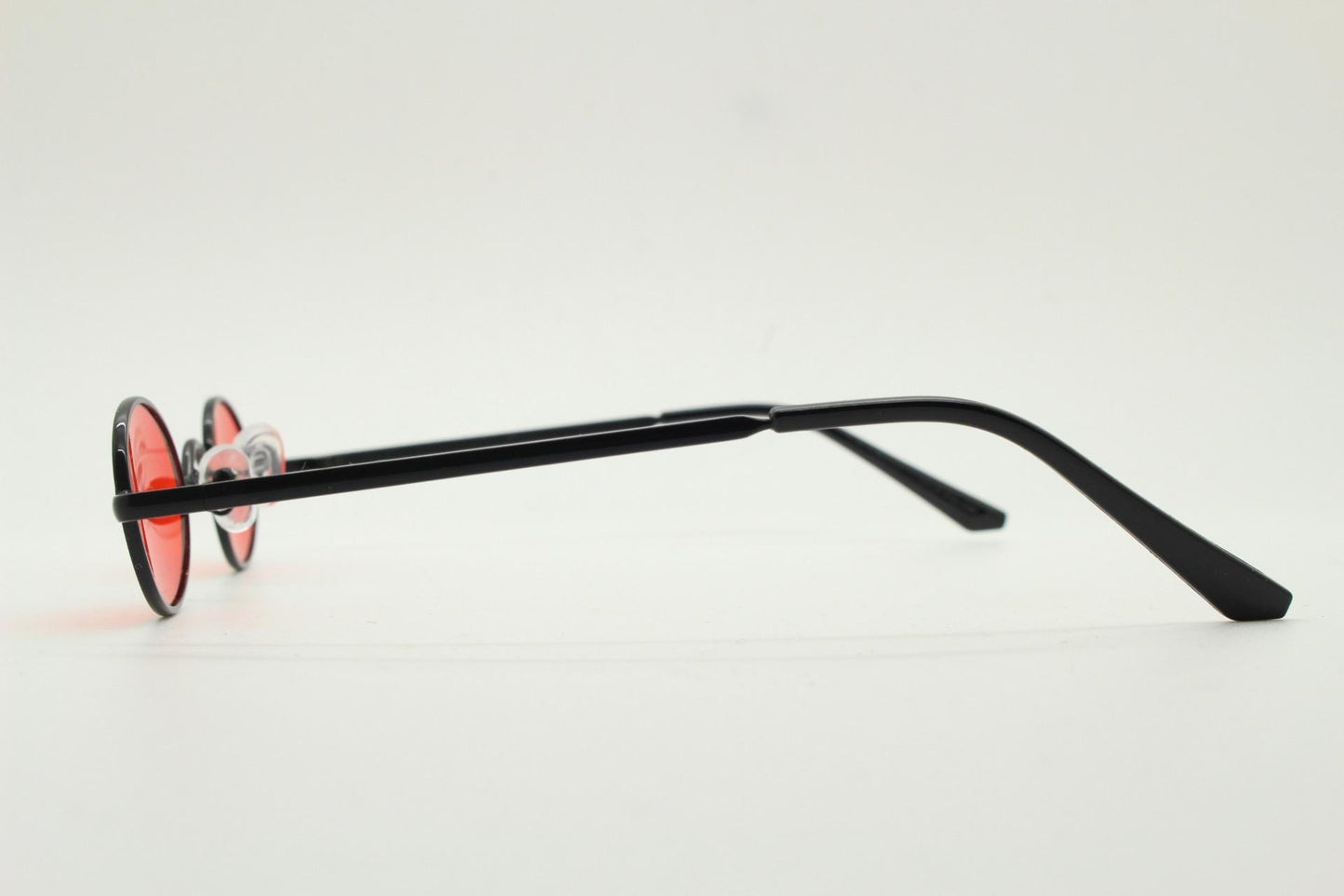 90s vintage small oval sunglasses. Imposing minimal black gloss metal victorian antique style frame with bright red lenses. Steampunk. NOS