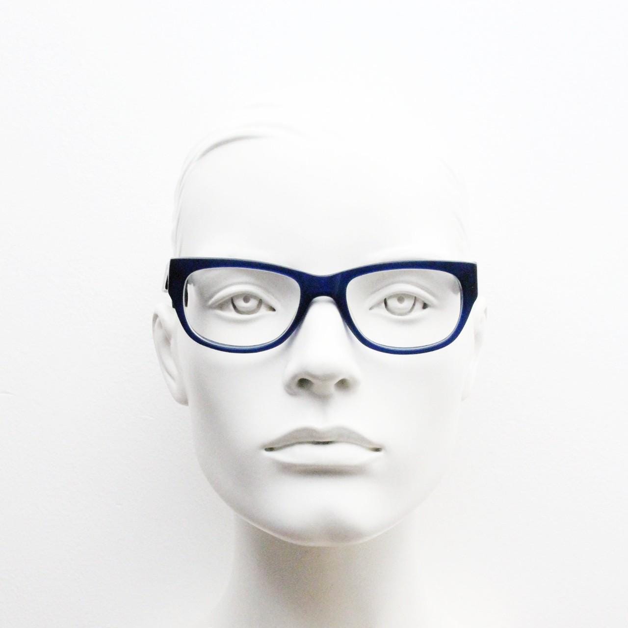 Chunky frame modified cat eye glasses. Superior quality optical eyeglasses. Deep blue front with wood look arms. Prescription RX Spectacles