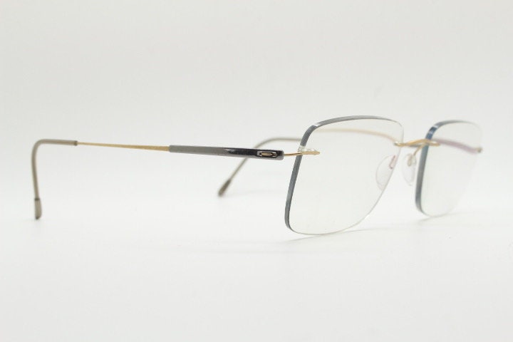 Silhouette rectangular frameless eye glasses model 7719 made in Austria. Minimal lightweight titanium optical frame. Prescription RX