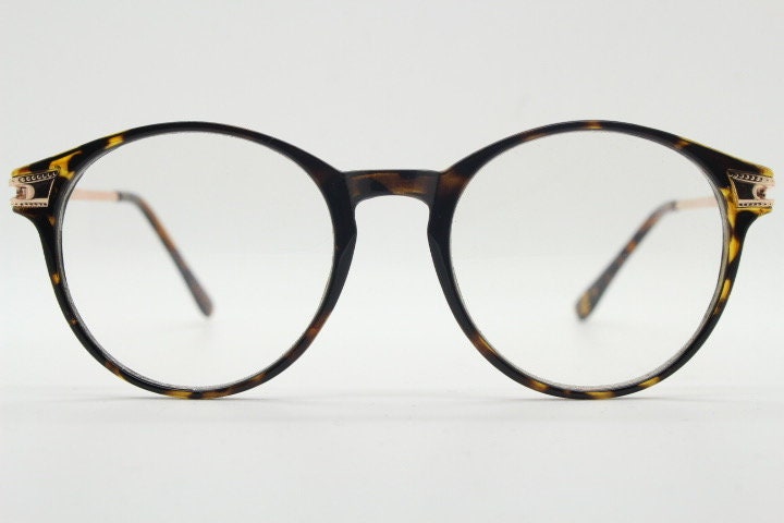 90s vintage round glasses with tortoise front and gold embossed arms. 40s, 50s style prescription optical frames. Clear lens eyeglasses. RX