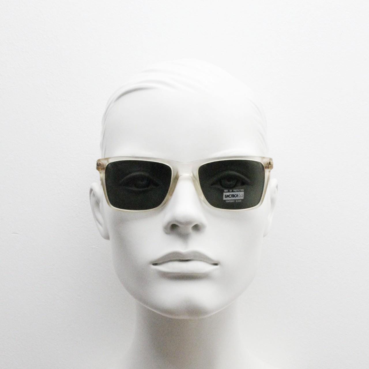 Luxottica 90s vintage rectangular sunglasses made in Italy. Transparent yellow acetate chunky frame with contrasting dark green lenses. BNWT