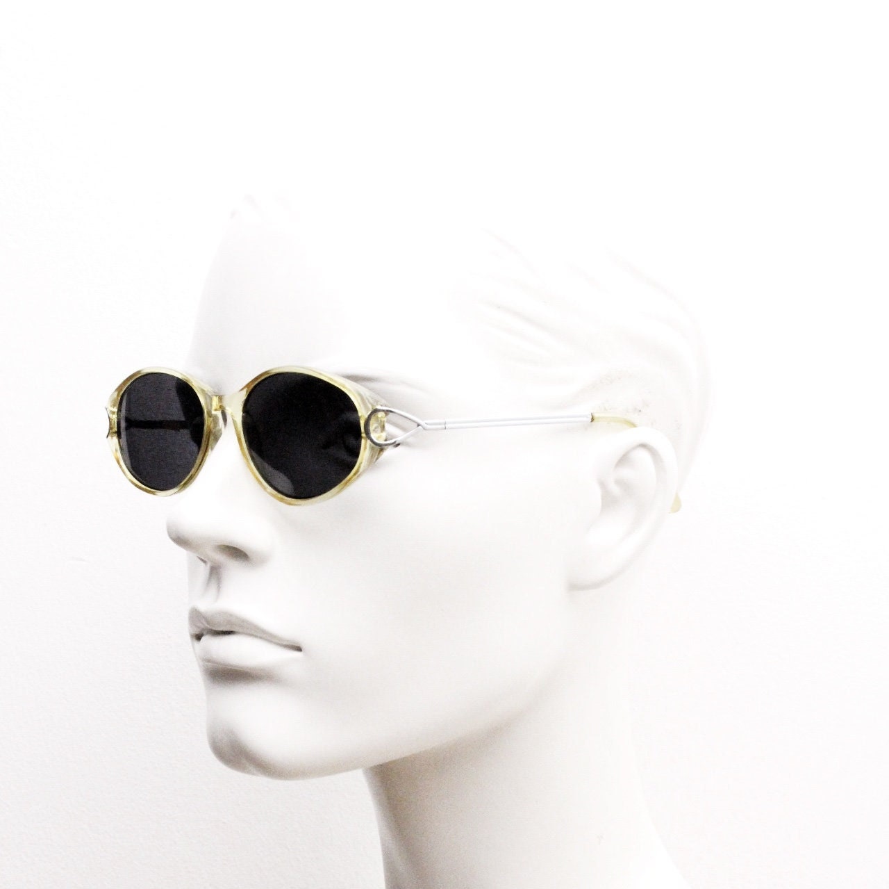 Carven Paris 90s vintage oval sunglasses. Womens transparent yellow frame with black lenses and silver metal arms. NOS