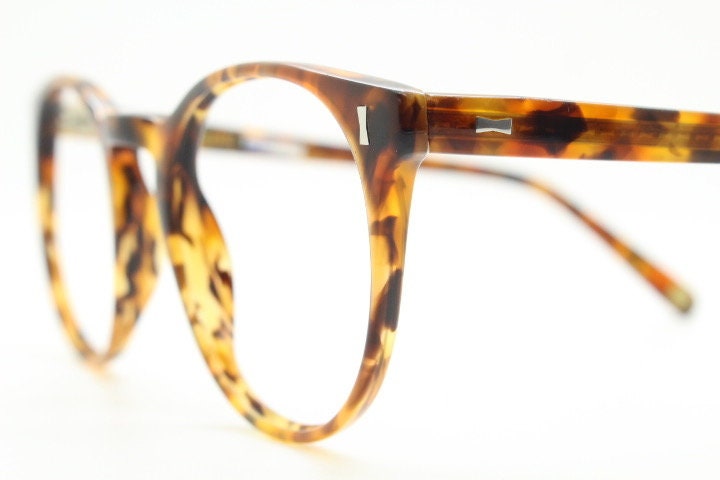 Cubitts vintage round 40s design hand made eye glasses. Honey tortoise acetate optical frame with keyhole bridge. Prescription RX