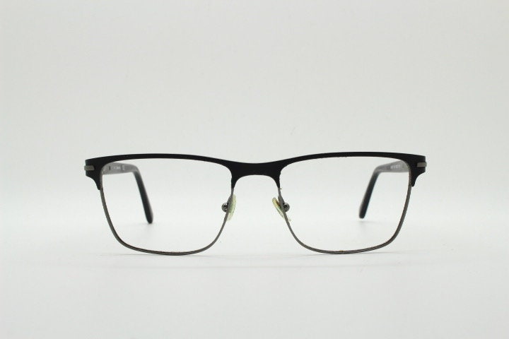 Calvin Klein rectangular eye glasses. Gunmetal grey chrome wire optical frames with black matt brow. Prescription eyeglasses. RX Spectacles