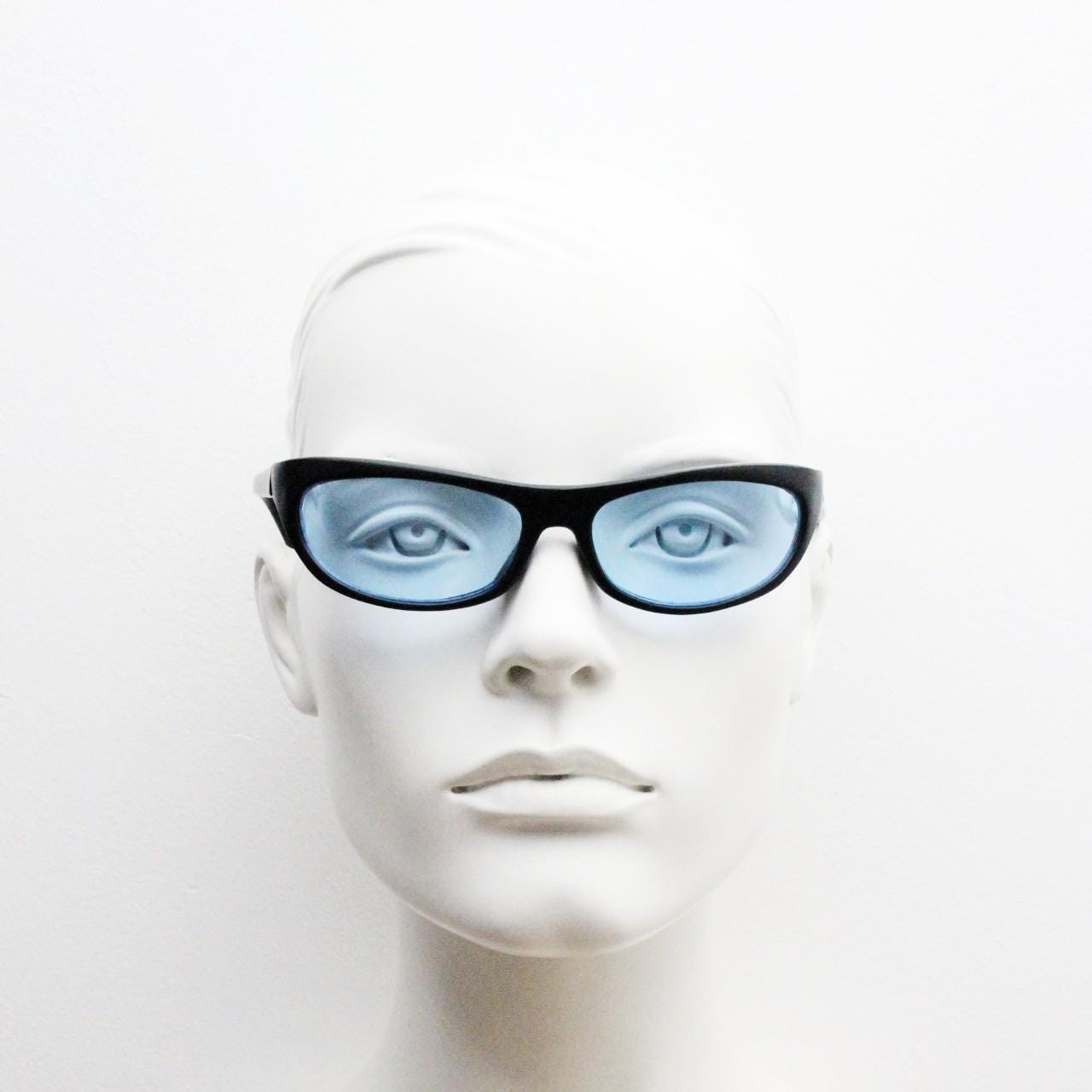 90s vintage curved wraparound sunglasses. Aerodynamic low profile black satin finish frame with light tone blue lenses. Sports shield. NOS