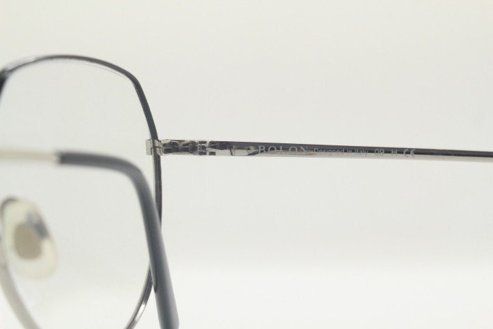 Bolon round panto flat top eye glasses model 7052. Slender silver metal optical frame with black brow. Prescription spectacles. Vintage RX