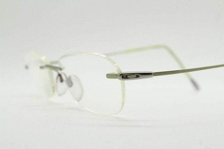 Silhouette rectangular frameless eye glasses made in Austria. Minimal lightweight optical frame with silver trim. Prescription RX