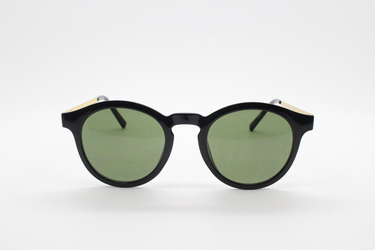 90s vintage round sunglasses. Black gloss frame with contrasting gold arms