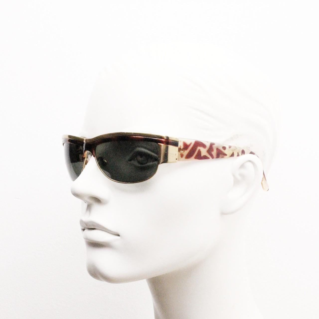 90s vintage visor shield sunglasses. Substantial metal curved wraparound frame with metallic tiger brow and abstract arm patterns. NOS. BNWT