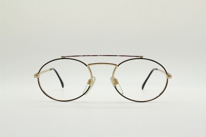 90s vintage oval eye glasses. Gold metal optical frame with vibrant enamel pattern and prominent double bridge. Prescription spectacles. NOS