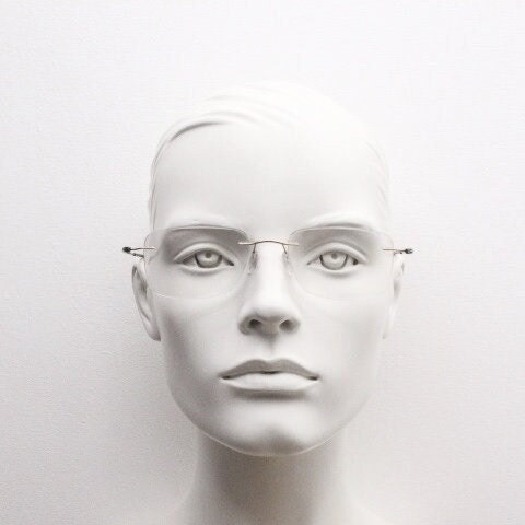 Silhouette rectangular frameless eye glasses model 7719 made in Austria. Minimal lightweight titanium optical frame. Prescription RX
