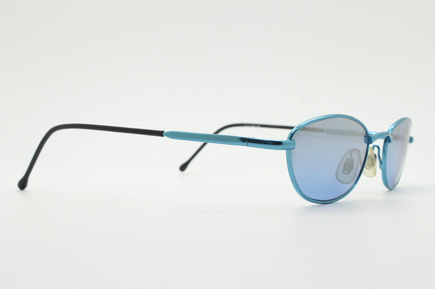 90s vintage small oval sunglasses by X-line. Unusual blue chrome metal frame with well matched mirror lenses. Quality NOS