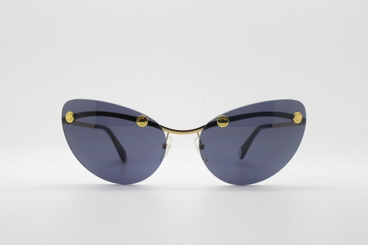 Moschino oval cat eye sunglasses model 082/S. Womens frameless cateye in perfect proportions with golden metal brow line
