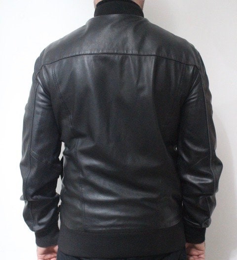 Paul Smith high collar bomber jacket. Plain black lambskin minimal flap pocket mens zipper. Ribbed collar. Size Medium