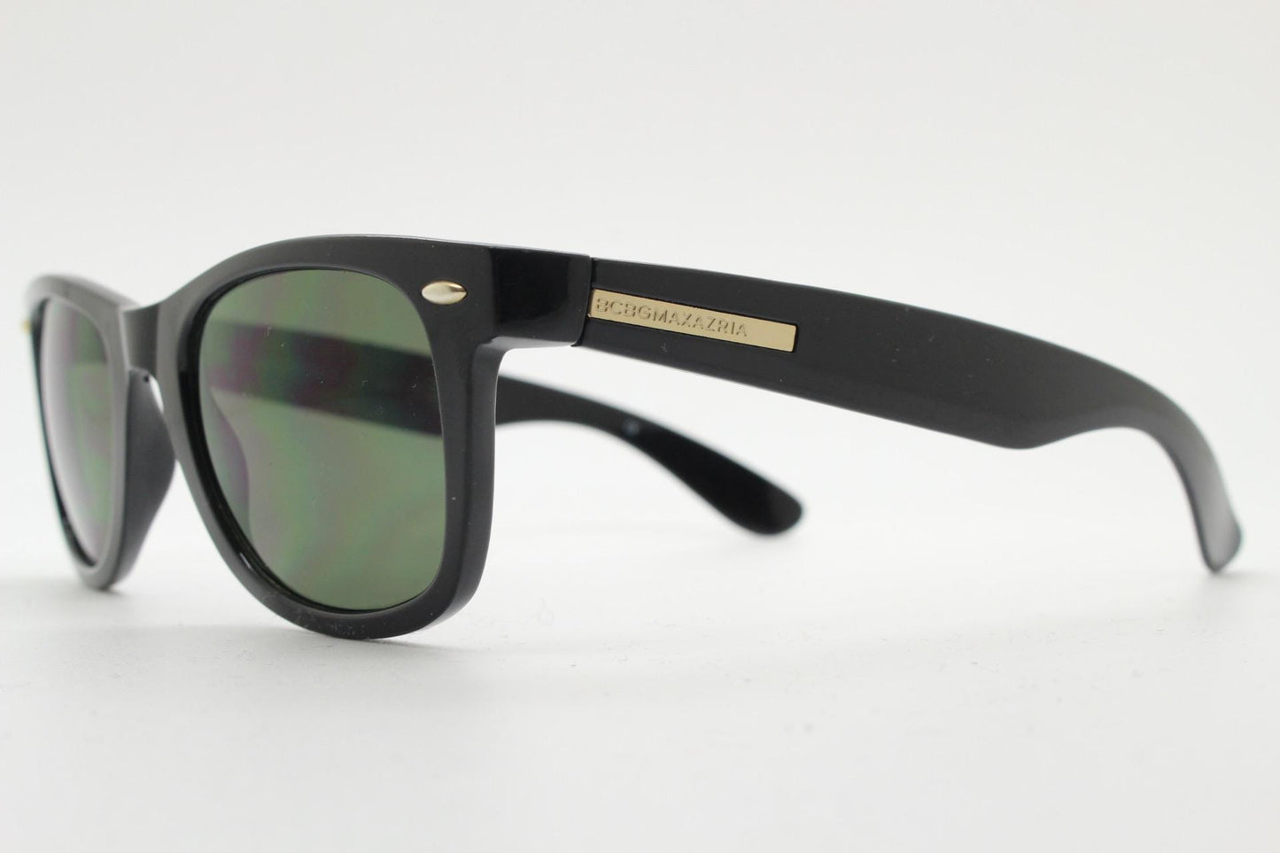 BCBG Max Azria vintage wayfarer design sunglasses. All time classic horn rim format in plain black gloss frame with green lenses.