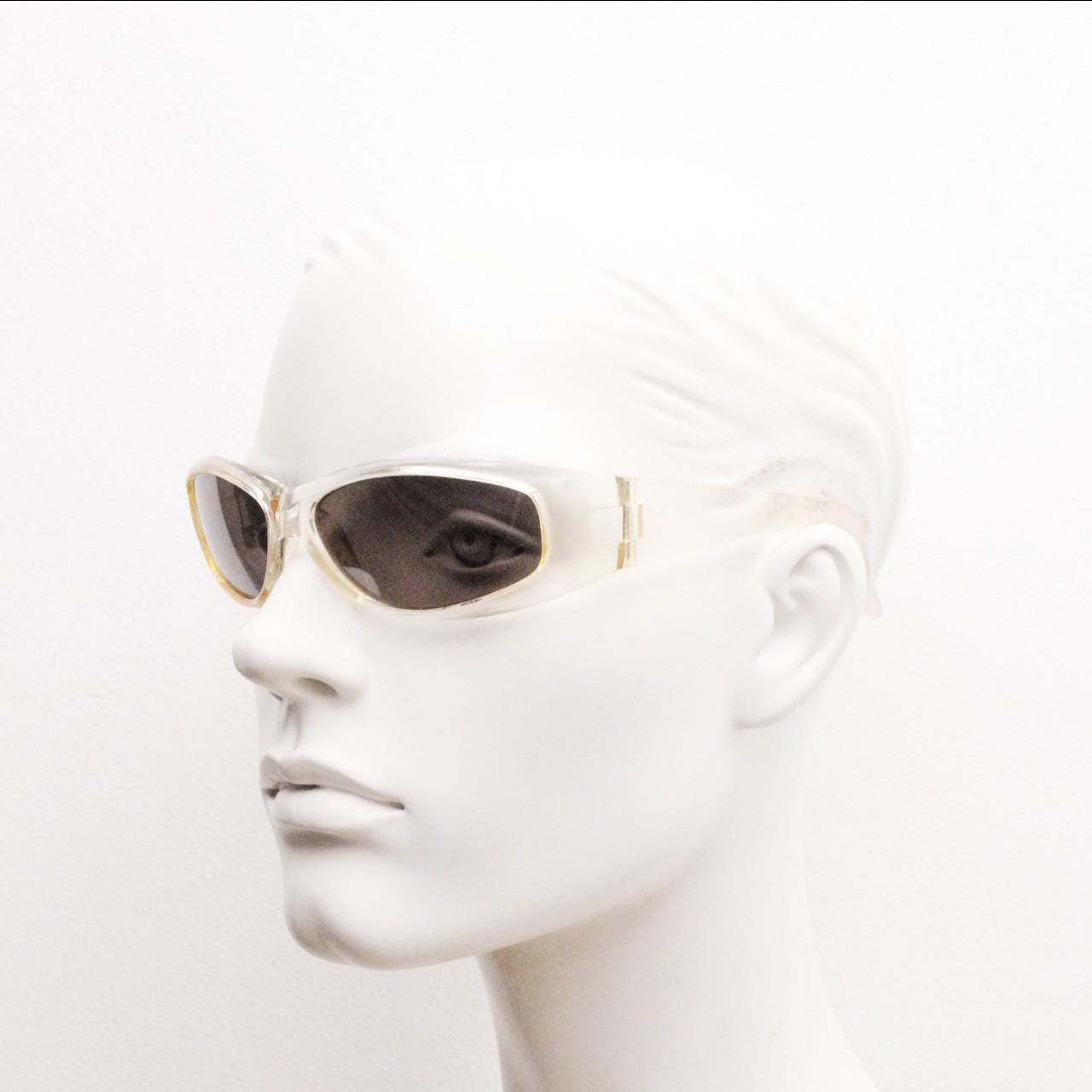 90s vintage sports shield sunglasses. Transparent yellow aerodynamic curved wraparound frame with contrasting black lenses. 2000's rave