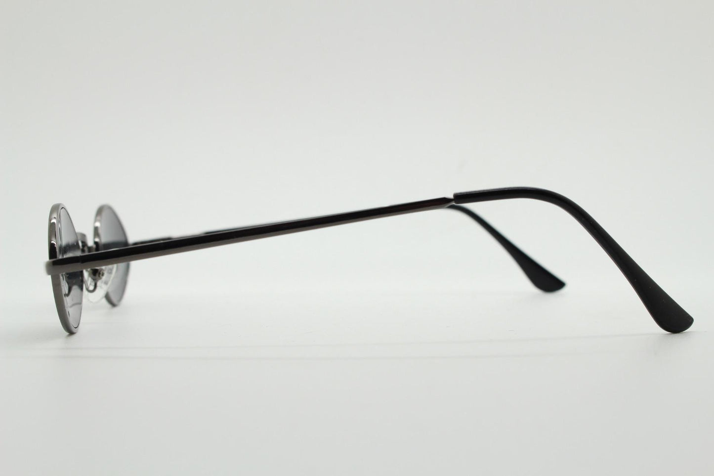 90s vintage small oval sunglasses. Imposing minimal gunmetal grey metal victorian style frame with black lenses. Steampunk. Unused BNWT