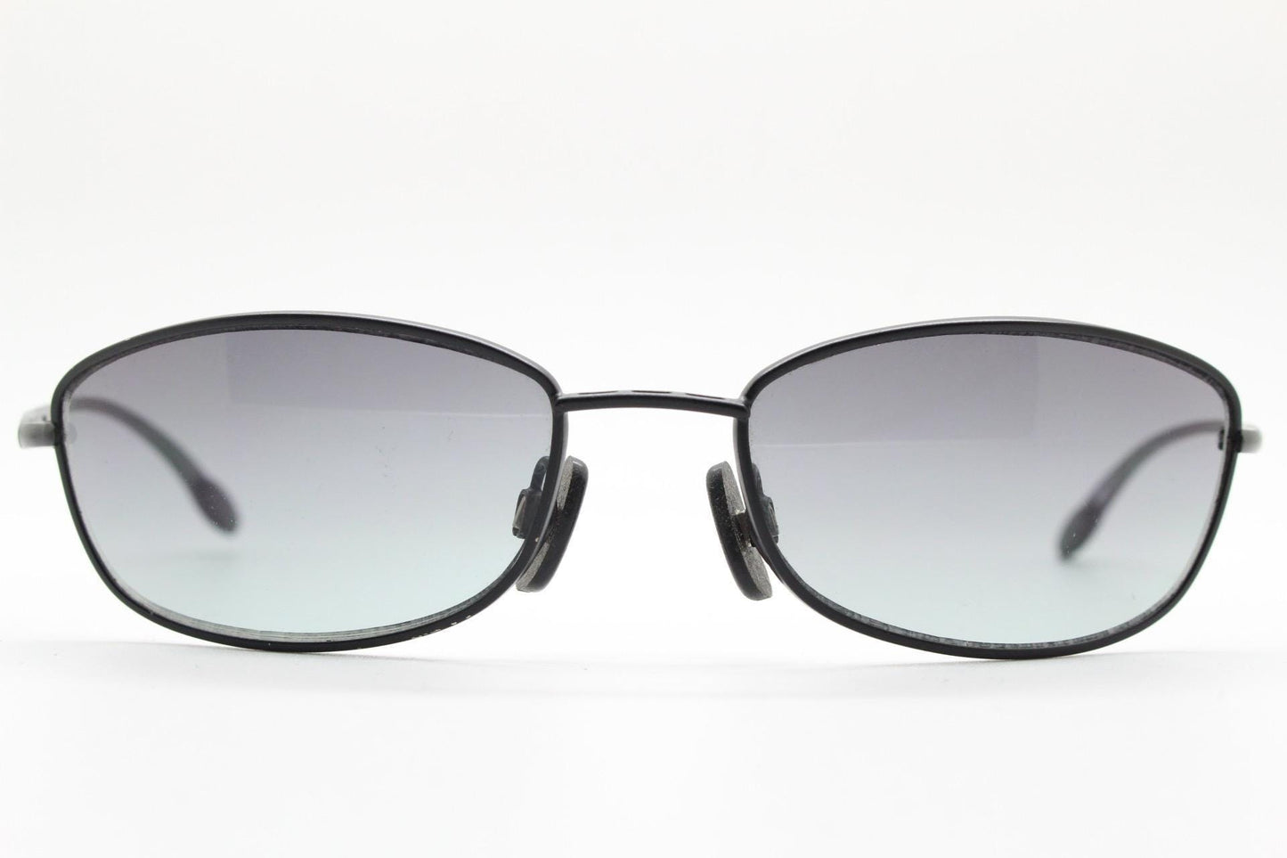 90s vintage curved rectangular sunglasses. Solid metal low profile black matt finish frame with slightly graduating lenses. 2000's. Y2K. NOS