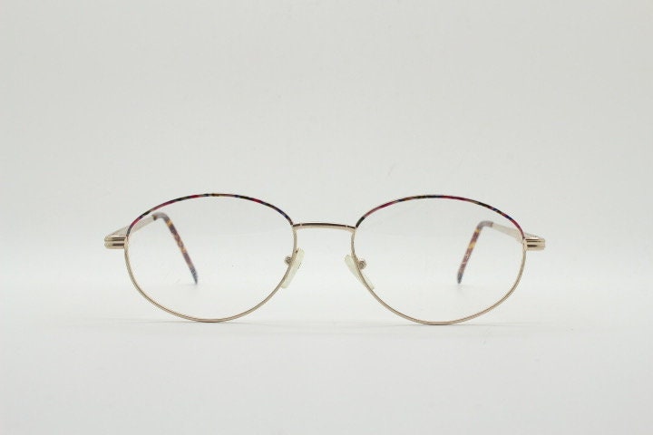 90s vintage oval eye glasses. Bright golden optical frames with coloured enamel brows. Prescription RX spectacles. Clear lens NOS