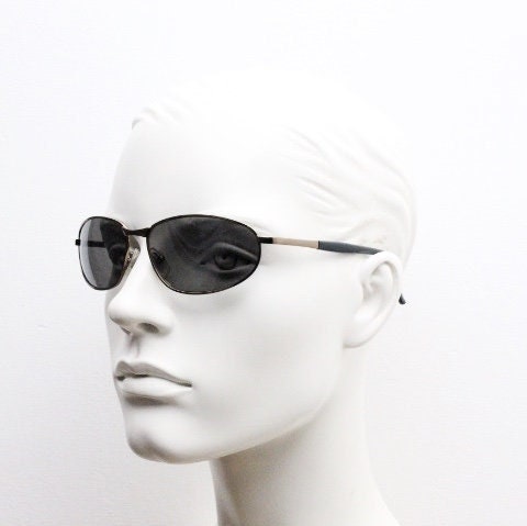 Y2K vintage small bug eye sunglasses. Curved brown chrome metal frame with black arms. Unused 2000s NOS