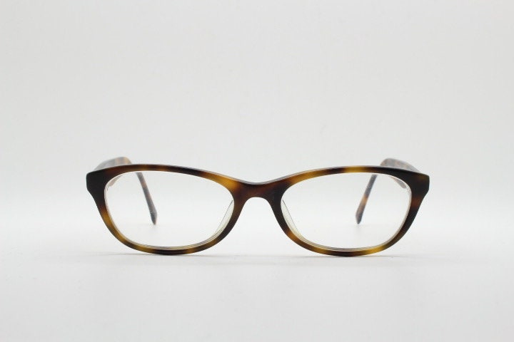 Calvin Klein Jeans modified cat eye glasses model CKJ918. Tortoise gloss low profile acetate optical frames. Prescription eyeglasses. RX