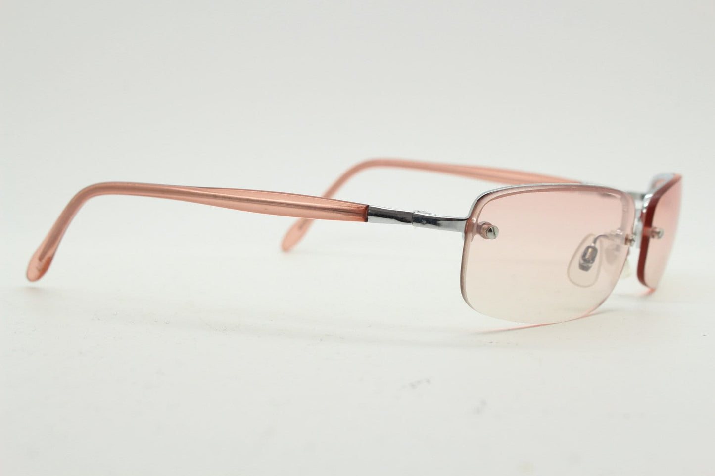 Y2K vintage wrap around rectangular sunglasses. Half frame in sharp chrome with extra light tone pink lenses. Rave 2000's. 00's NOS