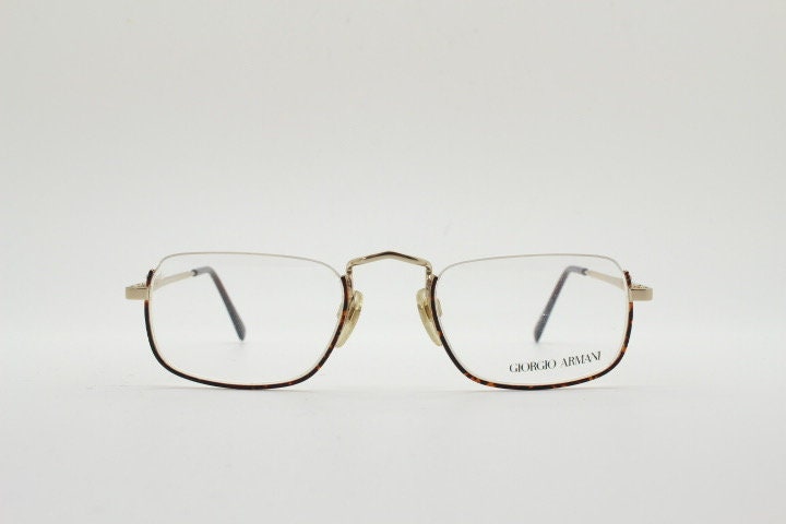 Giorgio Armani rectangular eye glasses made in Italy. Half frame underwire with metallic tortoise enamel. Prescription optical eyeglasses RX