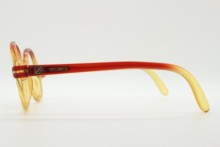 Viennaline 70s vintage round eye glasses made from Optyl. Red to yellow ombre fade optical frames. Womens NOS prescription RX eyeglasses