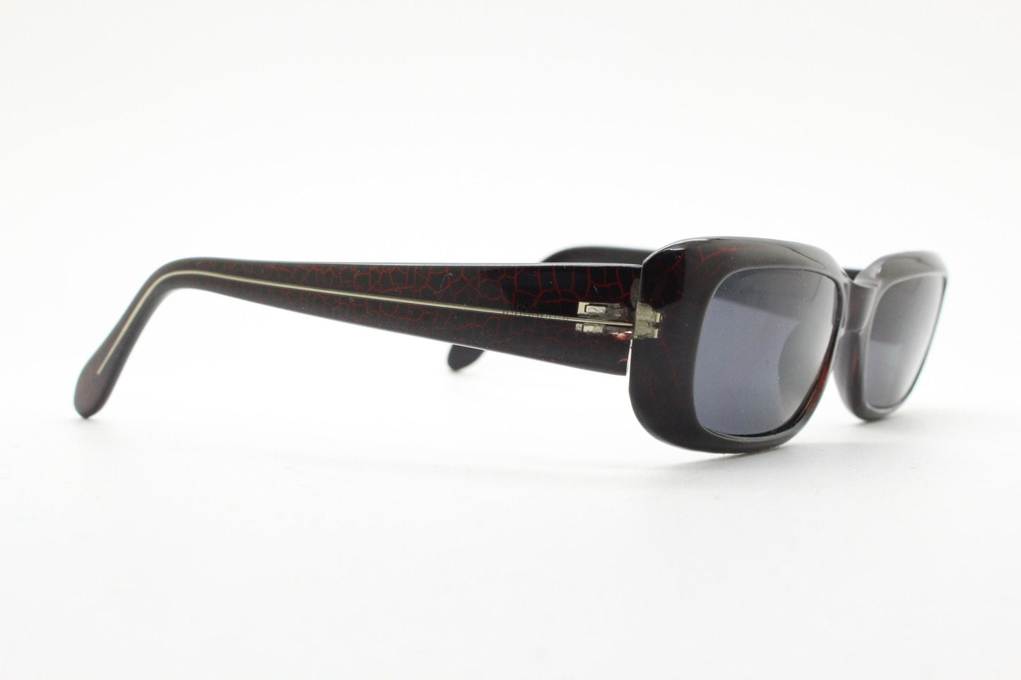 90s authentic vintage abstract rectangular sunglasses. Thickened black frame with red crackle print. NOS