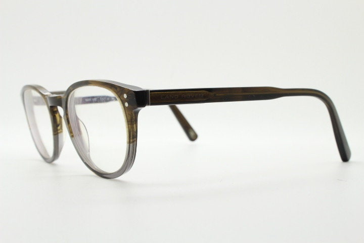 Land Rover vintage round 40s design eye glasses.Mottled brown and grey acetate optical frame with keyhole bridge. Prescription RX