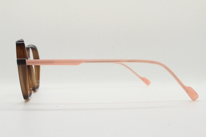 Caroline Abram square hexagon eye glasses model Caline. Dark brown acetate optical frame with pink arms. Prescription RX spectacles