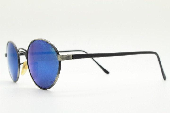 90s vintage oval panto sunglasses. Brushed bronze metal frame with cool blue mirror lenses and black slender arms. Unused NOS