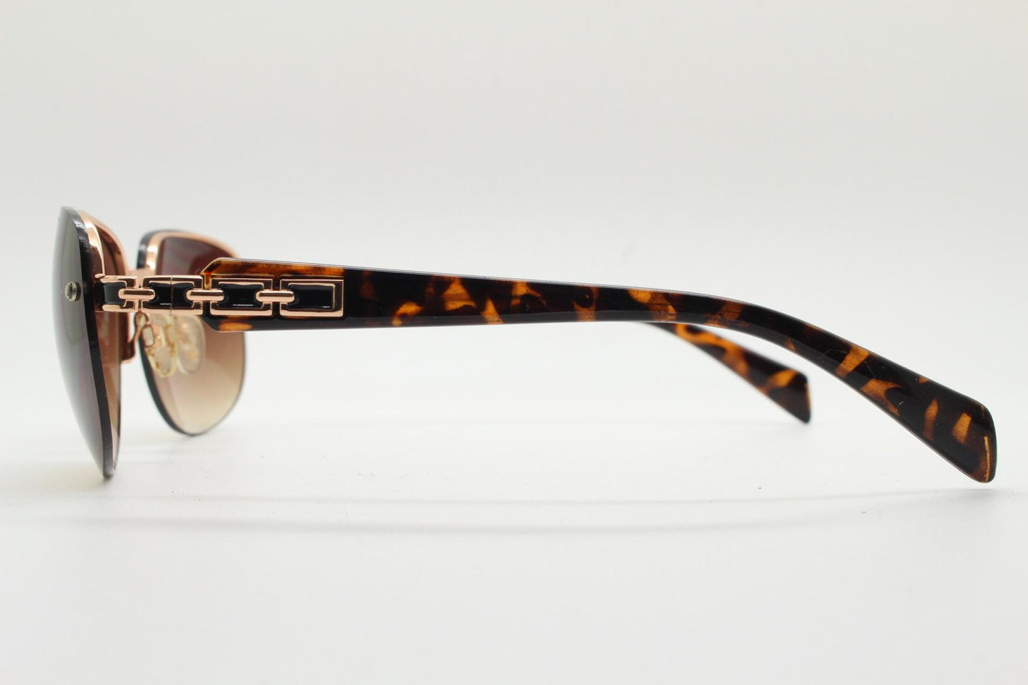 Y2K vintage rectangular brown sunglasses. Gold half frame with tortoise arms, chain link temples and graduating lenses. 2000's NOS
