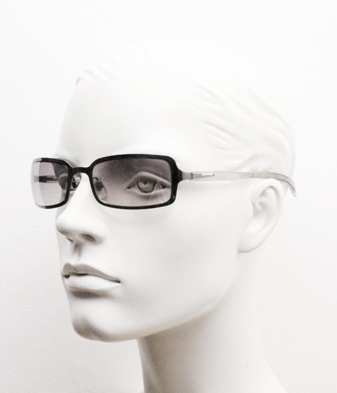 Y2K vintage rectangular sunglasses. Low profile mini shield frame in gunmetal chrome with light tone graduated mirror lens. 2000's. 90s. NOS