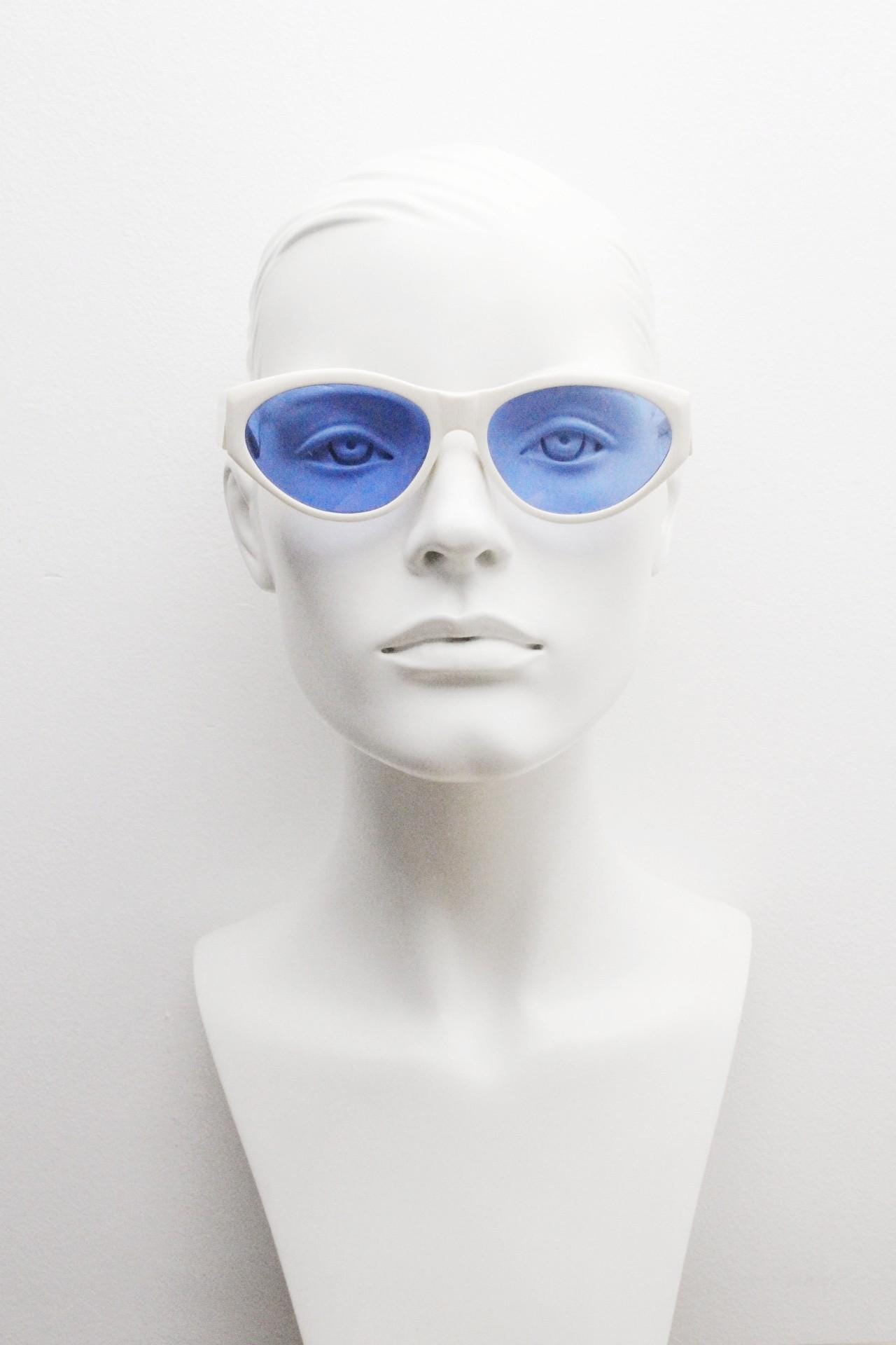 Benson and Ashley vintage 80s cat eye sunglasses hand made in England. 50s design white acetate cateye frame with cobalt blue lenses. NOS