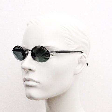 Inkognito 90s vintage small oval sunglasses. Matt finish half frame with spell out logo brow and polarising lenses. NOS